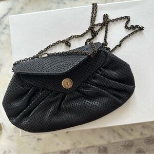 Lauren Merkin black textured bag or clutch.